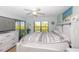 Main bedroom with lake view and ceiling fan at 1348 Rock Dove Ct # C204, Punta Gorda, FL 33950