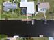 Aerial view showing house, dock, boat, and canal at 136 Godfrey Ne Ave, Port Charlotte, FL 33952