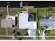 Aerial view showing house, pool, dock, and boat at 136 Godfrey Ne Ave, Port Charlotte, FL 33952