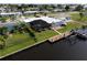 Aerial view showcasing home, canal-front location, and dock at 136 Godfrey Ne Ave, Port Charlotte, FL 33952