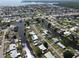 Aerial view of canal-front homes and neighborhood at 136 Godfrey Ne Ave, Port Charlotte, FL 33952