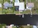 Aerial view of home, dock, and surrounding neighborhood at 136 Godfrey Ne Ave, Port Charlotte, FL 33952