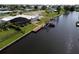 Backyard with canal access, pool, and dock at 136 Godfrey Ne Ave, Port Charlotte, FL 33952