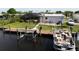 Backyard oasis with pool, dock, and boat at 136 Godfrey Ne Ave, Port Charlotte, FL 33952