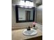 Bathroom with vanity sink and large mirror at 136 Godfrey Ne Ave, Port Charlotte, FL 33952