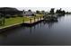 Private dock with a boat lift and access to the waterway at 136 Godfrey Ne Ave, Port Charlotte, FL 33952