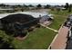 Screened-in pool and patio with lush landscaping at 136 Godfrey Ne Ave, Port Charlotte, FL 33952