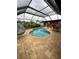 Relaxing pool area with covered patio and seating at 136 Godfrey Ne Ave, Port Charlotte, FL 33952