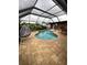 Relaxing pool area with covered patio and seating at 136 Godfrey Ne Ave, Port Charlotte, FL 33952