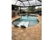 Relaxing kidney-shaped pool with two lounge chairs at 136 Godfrey Ne Ave, Port Charlotte, FL 33952