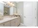 Elegant bathroom with double vanity and a large mirror at 1454 Surfbird Ct, Punta Gorda, FL 33950