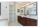 Bathroom with a walk-in shower and double vanity at 1454 Surfbird Ct, Punta Gorda, FL 33950