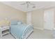 Cozy bedroom with light blue bedding and white iron bed frame at 1454 Surfbird Ct, Punta Gorda, FL 33950