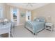 Bright bedroom with white furniture and large windows at 1454 Surfbird Ct, Punta Gorda, FL 33950