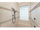 Large walk-in shower with tiled walls and glass block window at 1454 Surfbird Ct, Punta Gorda, FL 33950