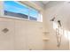 Clean shower with tiled walls and multiple shower heads at 1454 Surfbird Ct, Punta Gorda, FL 33950