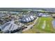 Aerial view of community clubhouse, pool, and driving range at 15100 River Birch Ct, Punta Gorda, FL 33955