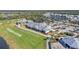 Aerial view of community clubhouse, pool, and driving range at 15100 River Birch Ct, Punta Gorda, FL 33955