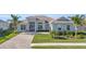 Single-story home with paver driveway at 15100 River Birch Ct, Punta Gorda, FL 33955