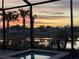 Sunset view from the screened-in spa at 15100 River Birch Ct, Punta Gorda, FL 33955