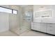 Modern bathroom with walk in shower and double vanity at 16322 Nogales Ct, Punta Gorda, FL 33955