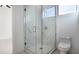 Bathroom with glass shower and marble tile at 16322 Nogales Ct, Punta Gorda, FL 33955