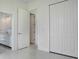 Bedroom with closet and access to bathroom at 16322 Nogales Ct, Punta Gorda, FL 33955