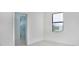 Bright bedroom with ensuite bathroom and large window at 16322 Nogales Ct, Punta Gorda, FL 33955