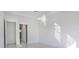 Light-filled bedroom with door to hallway at 16322 Nogales Ct, Punta Gorda, FL 33955