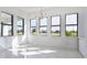 Bright dining room with large windows and modern chandelier at 16322 Nogales Ct, Punta Gorda, FL 33955