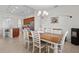 Bright dining room with a large table and chairs, adjacent to the kitchen at 17138 Anthem Ln, Punta Gorda, FL 33955