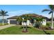 Single-story home with a modern design,garage, and landscaped yard at 17138 Anthem Ln, Punta Gorda, FL 33955