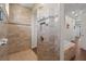 Large walk-in shower with neutral tile and built-in shelving at 17138 Anthem Ln, Punta Gorda, FL 33955