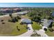 Aerial view showing two houses and a neighborhood with water views at 17521 Pomegrante Way, Punta Gorda, FL 33955