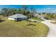 Aerial view of two homes on a spacious lot with lush landscaping at 17521 Pomegrante Way, Punta Gorda, FL 33955