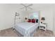 Cozy bedroom with a double bed, white dresser, and nautical decor at 17521 Pomegrante Way, Punta Gorda, FL 33955