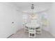 Charming breakfast nook features a white table and chairs, bathed in natural light at 17521 Pomegrante Way, Punta Gorda, FL 33955