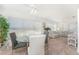 Sunlit dining area with glass table and chairs, and a floral sofa at 17521 Pomegrante Way, Punta Gorda, FL 33955