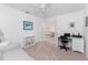 Home office with built-in shelving and French doors leading to the Primary bedroom at 17521 Pomegrante Way, Punta Gorda, FL 33955