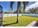 Large backyard with grassy area and privacy fence at 1824 Dawnview St, North Port, FL 34288