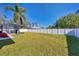 Spacious backyard with grassy area and privacy fence at 1824 Dawnview St, North Port, FL 34288