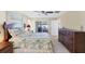 Main bedroom with king bed and direct access to backyard at 1824 Dawnview St, North Port, FL 34288