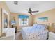 Bright bedroom with a queen bed, a TV, and a view of the backyard at 1824 Dawnview St, North Port, FL 34288