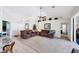 Living area with brown couches and a view into the kitchen at 1824 Dawnview St, North Port, FL 34288