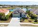 Aerial view of a single-Gathering home community with a lake at 1840 Bobcat Trl, North Port, FL 34288