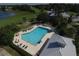 Aerial view of community pool and surrounding area at 1840 Bobcat Trl, North Port, FL 34288