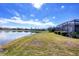 Spacious backyard with screened lanai overlooking a lake at 1840 Bobcat Trl, North Port, FL 34288