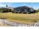 Backyard oasis with screened lanai and lake access at 1840 Bobcat Trl, North Port, FL 34288