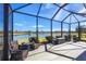 Relaxing screened patio with lake views at 1840 Bobcat Trl, North Port, FL 34288