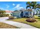 Single-Gathering home with a green exterior and tile roof at 1840 Bobcat Trl, North Port, FL 34288